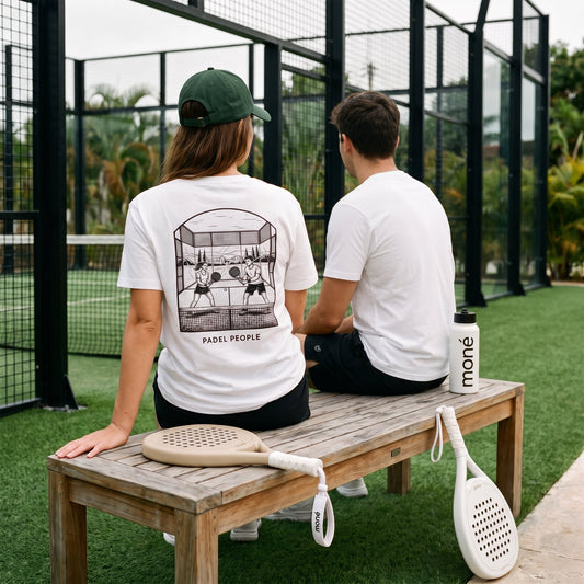 A male and female player sitting outside a padel court with Hybrid moné rackets