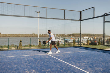 Padel player returning a ball