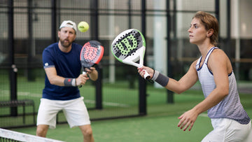 Man and woman playing padel