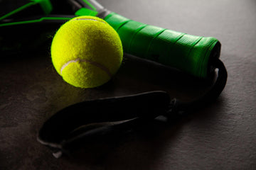 Racket next to a padel ball