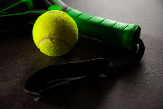 Racket next to a padel ball