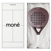 Luxury unboxing of the designer Moné Padel Cocoa racket inside a premium white presentation box.