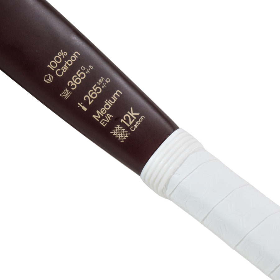 Close-up of Moné Padel Cocoa racket specs showing 12K Carbon frame, Medium EVA core, and 365g weight.