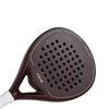 Detailed surface view of the Moné Padel Cocoa premium racket showing teardrop hole pattern and dark finish.