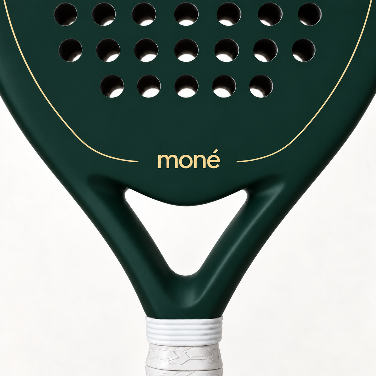 Close-up of the Forest dark green padel racket throat, with the gold moné logo and outline above its open triangle