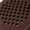 Macro of the Cocoa brown padel racket face, showing its matte finish, drilled hole pattern and thin beige outline