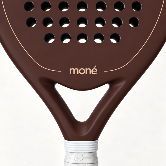 Close-up of the Cocoa brown padel racket throat, with the beige moné logo and outline above its open triangle