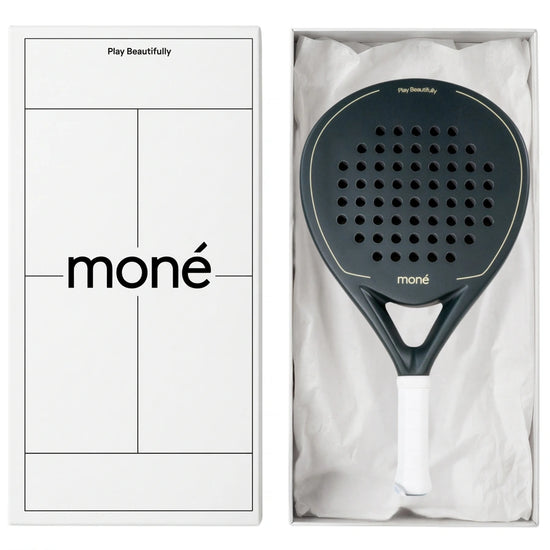 Luxury unboxing of the designer Moné Padel Forest racket inside a premium white presentation box.