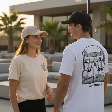 Two people standing outdoors, one wearing a beige cap and t-shirt, the other wearing a white t-shirt with a graphic design. Classic Cotton Cap | Mone Padel | Moné Padel