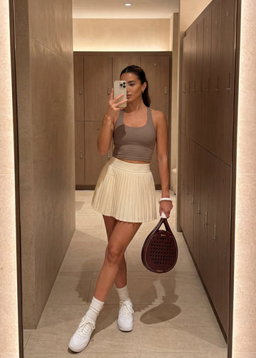 Female padel player holding mone racket 