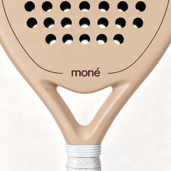 Close-up of the Sahara beige padel racket throat, with the cocoa brown moné logo and outline above its open triangle