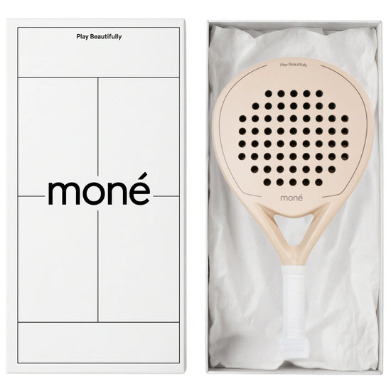 Luxury unboxing of the designer Moné Padel Sahara racket inside a premium white presentation box.