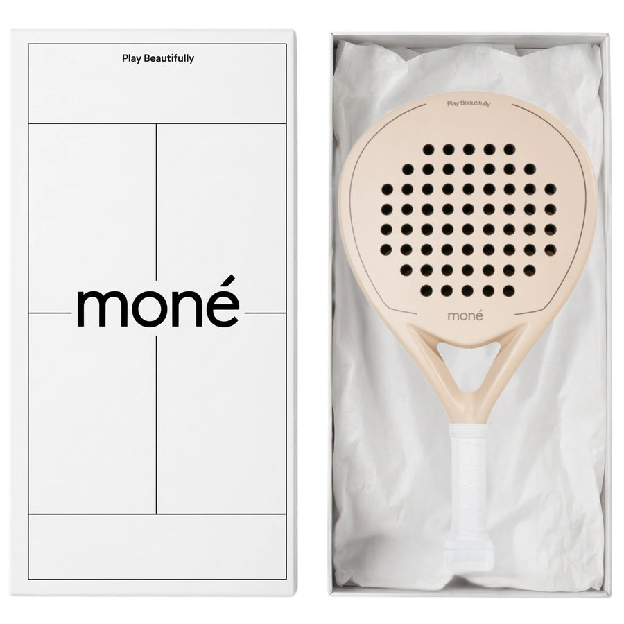 Luxury unboxing of the designer Moné Padel Sahara racket inside a premium white presentation box.