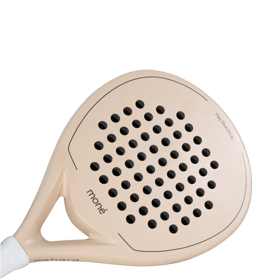 Detailed view of the Moné Padel Sahara racket surface showing the teardrop hole pattern and matte finish.