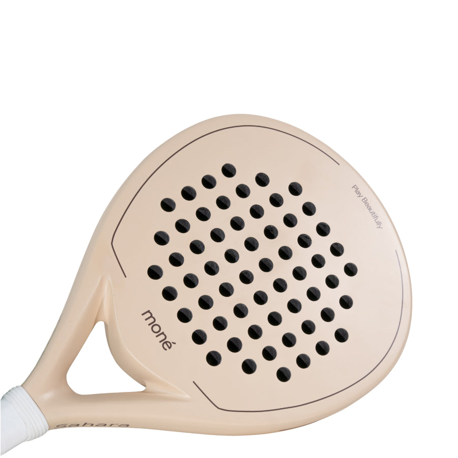 Detailed view of the Moné Padel Sahara racket surface showing the teardrop hole pattern and matte finish.