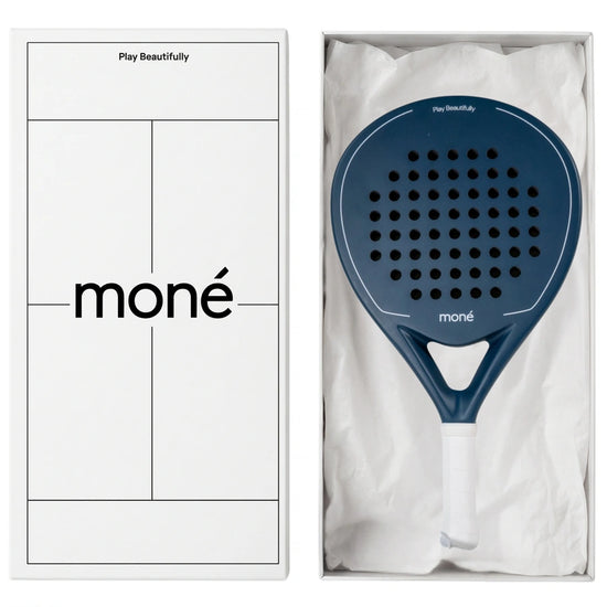 Luxury unboxing of the designer Moné Padel racket inside a premium white presentation box.