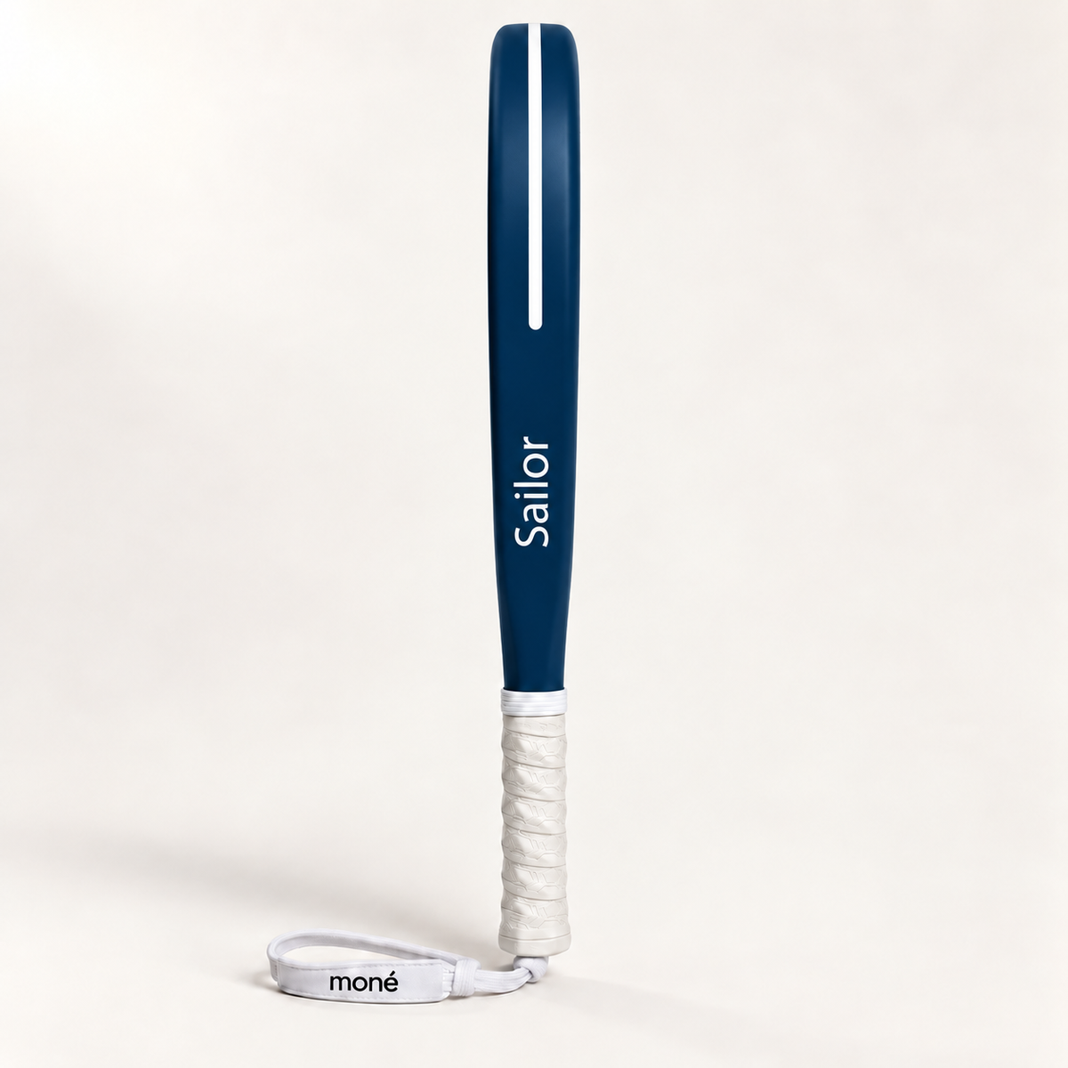 Sailor blue padel racket in side profile, with Sailor printed in white along the frame, a white grip and wrist strap