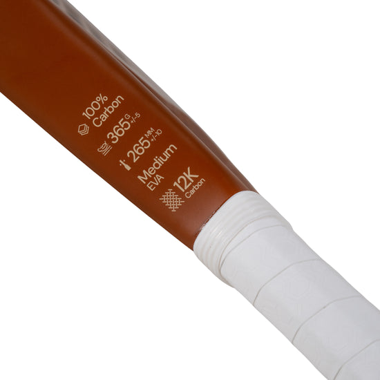 Close-up of Moné Padel Sienna racket specs showing 12K Carbon frame, Medium EVA core, and 365g weight.