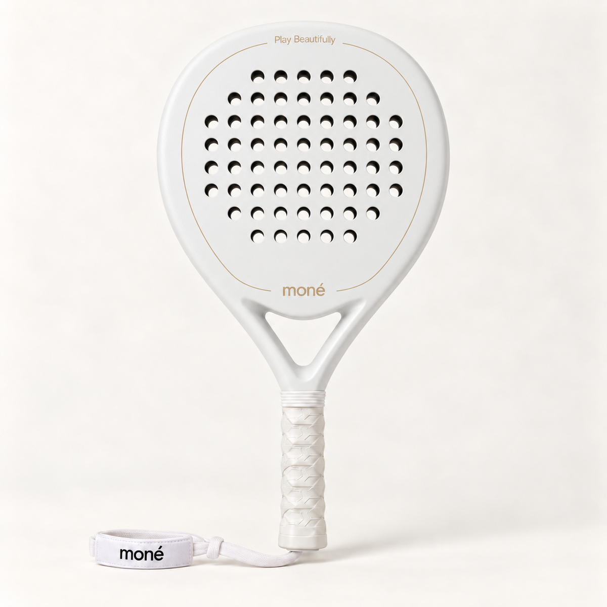 Front view of the off-white Ivory Hybrid padel racket with a gold moné logo, white grip and matching wrist strap