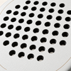 Macro of the off-white Ivory Hybrid padel racket face, showing its rough spin texture and drilled hole pattern