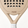 Open throat and brown moné logo on the beige face of the Sahara Hybrid padel racket, just above the grip