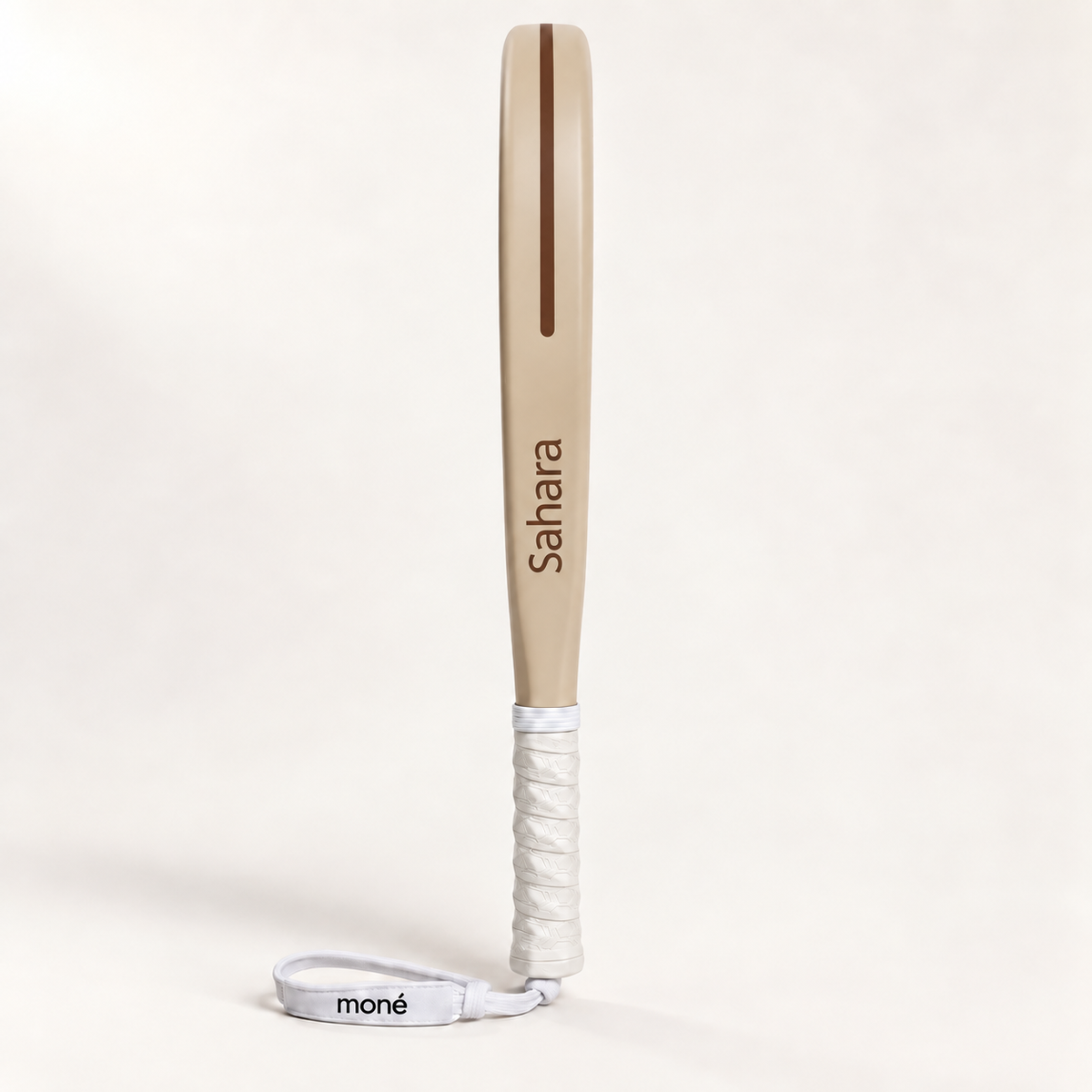 Side profile of the Sahara Hybrid padel racket, a beige frame with Sahara printed in brown and a white grip