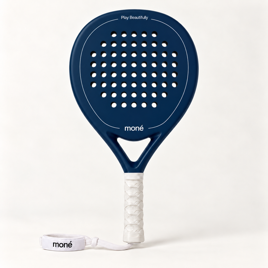 Sailor blue padel racket by moné, front view: teardrop head, Play Beautifully lettering, white grip and wrist strap