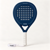 Sailor blue padel racket by moné, front view: teardrop head, Play Beautifully lettering, white grip and wrist strap