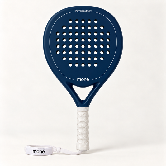 Sailor blue padel racket by moné, front view: teardrop head, Play Beautifully lettering, white grip and wrist strap