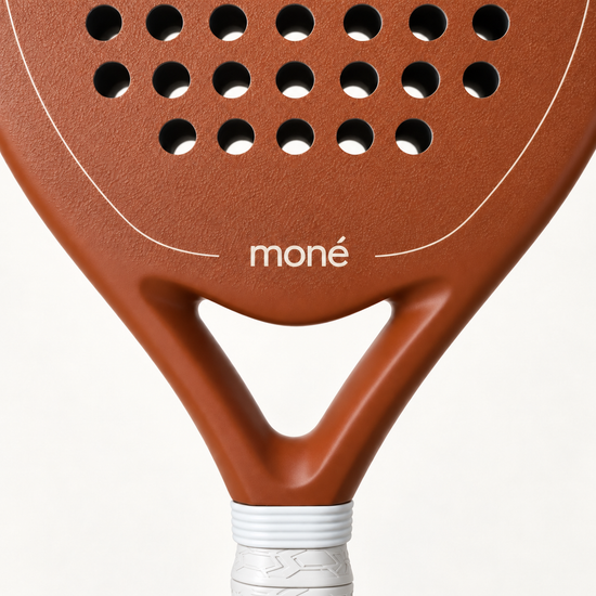 Close-up of the open throat and cream moné logo on the light brown face of the Sienna Hybrid padel racket