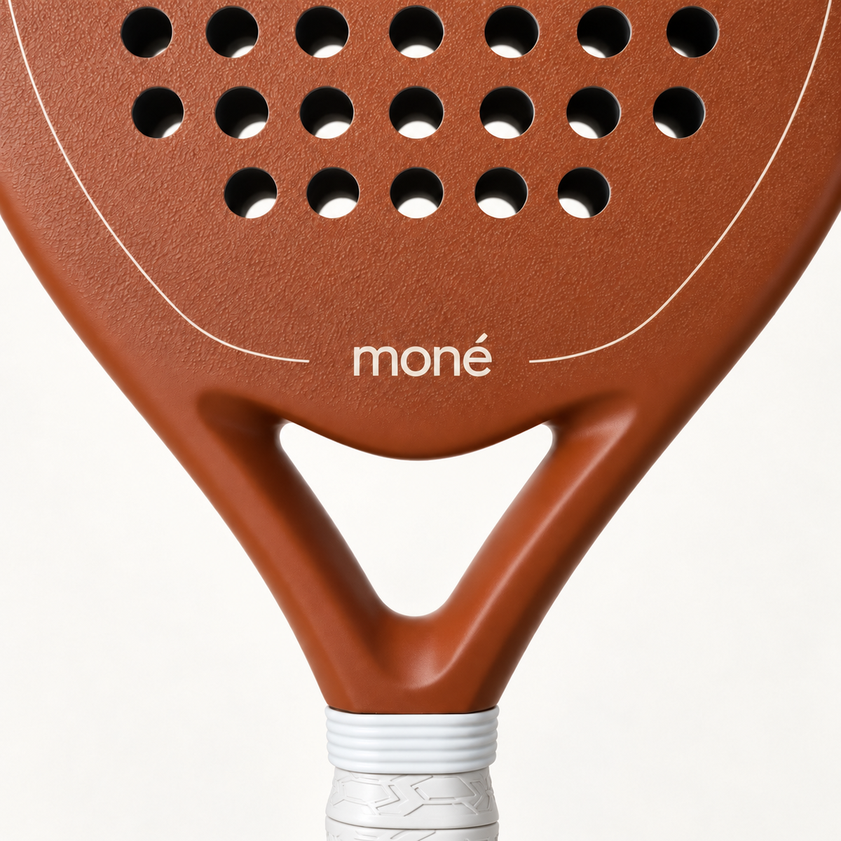 Close-up of the open throat and cream moné logo on the light brown face of the Sienna Hybrid padel racket